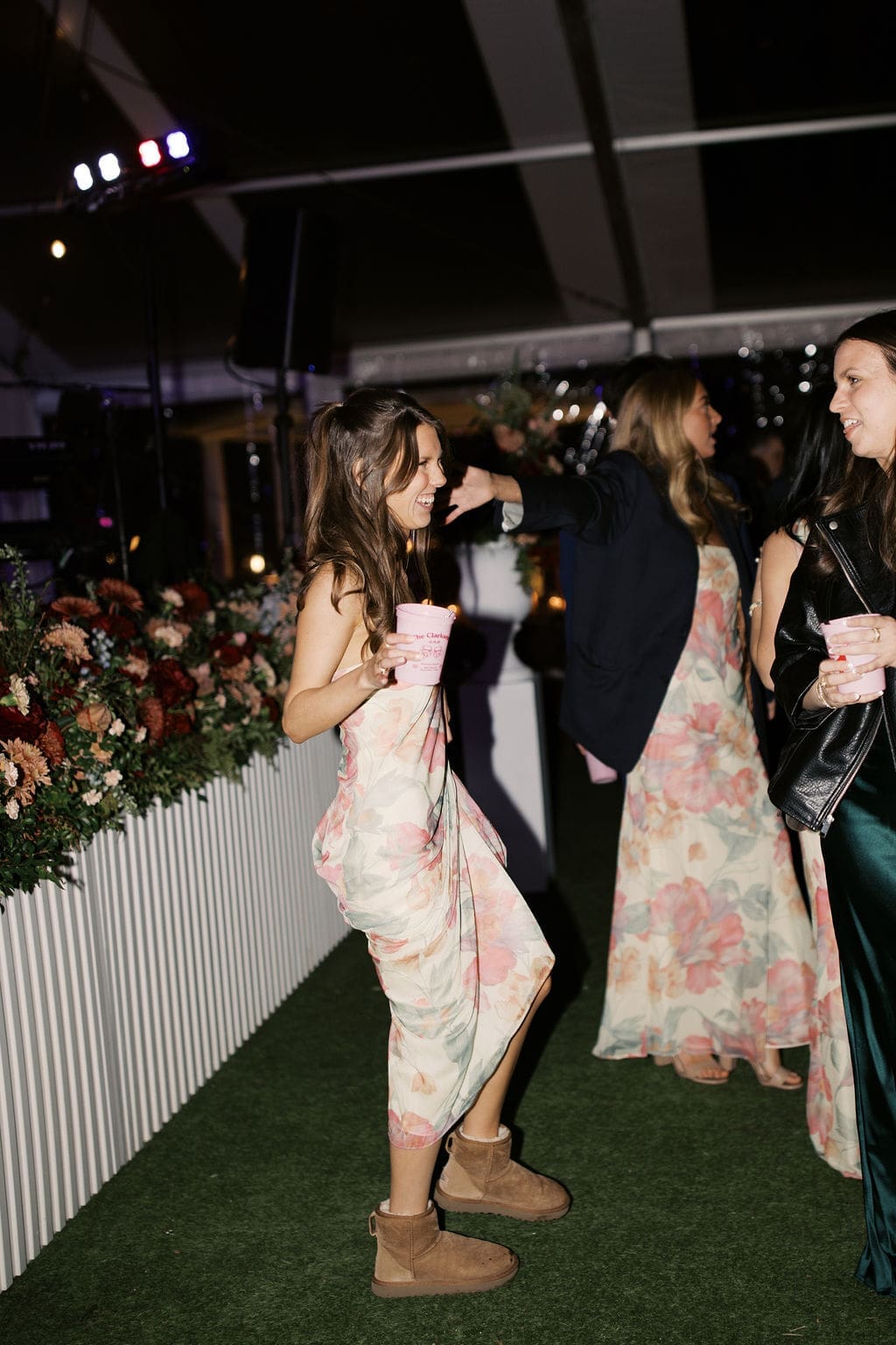 Bridesmaids laughing and dancing with drinks during the reception of a joyful Mansion Wedding celebration.