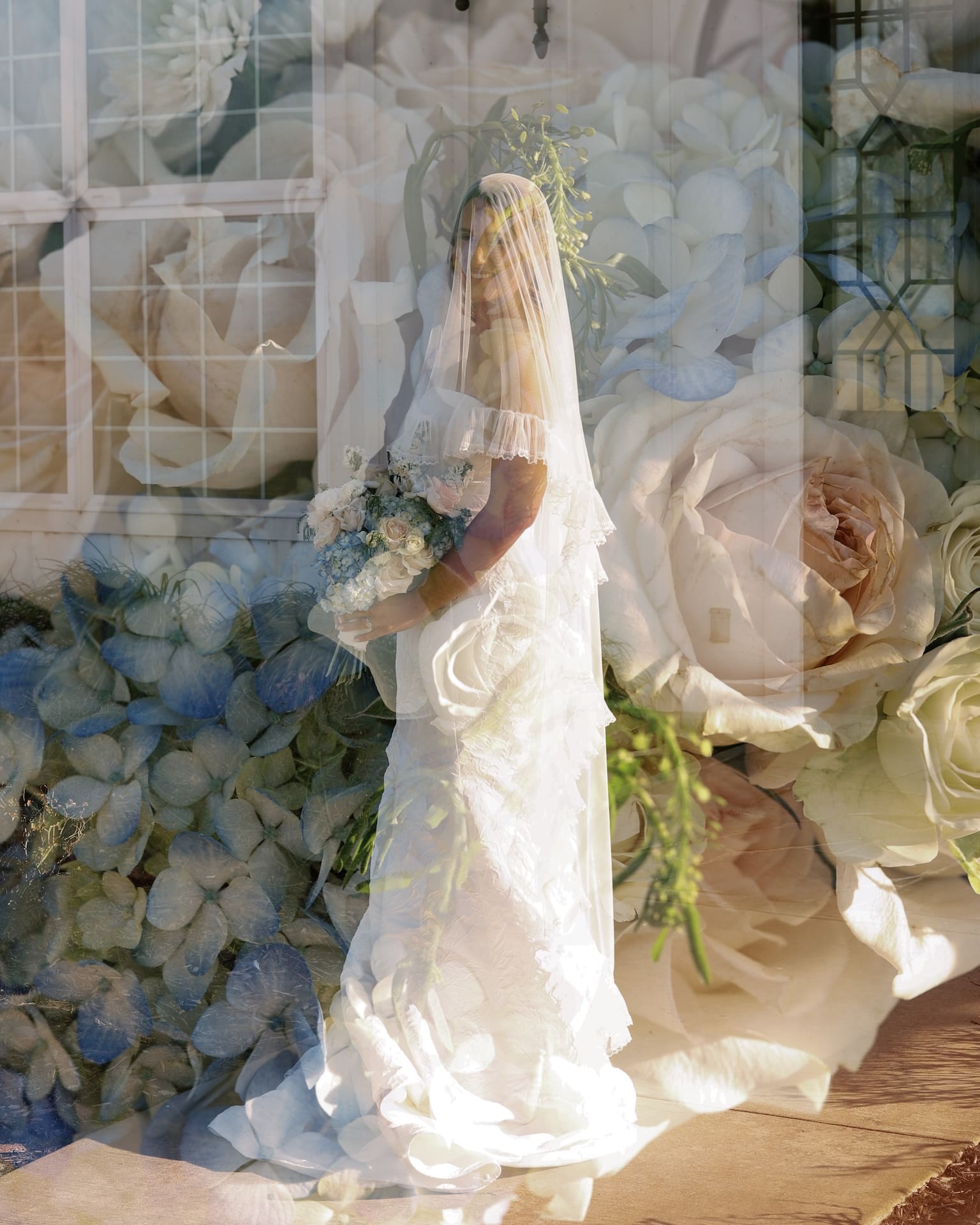 Dreamy bridal portraits captured in a double exposure, blending a bride in a lace mermaid gown with an oversized floral background of roses and hydrangeas