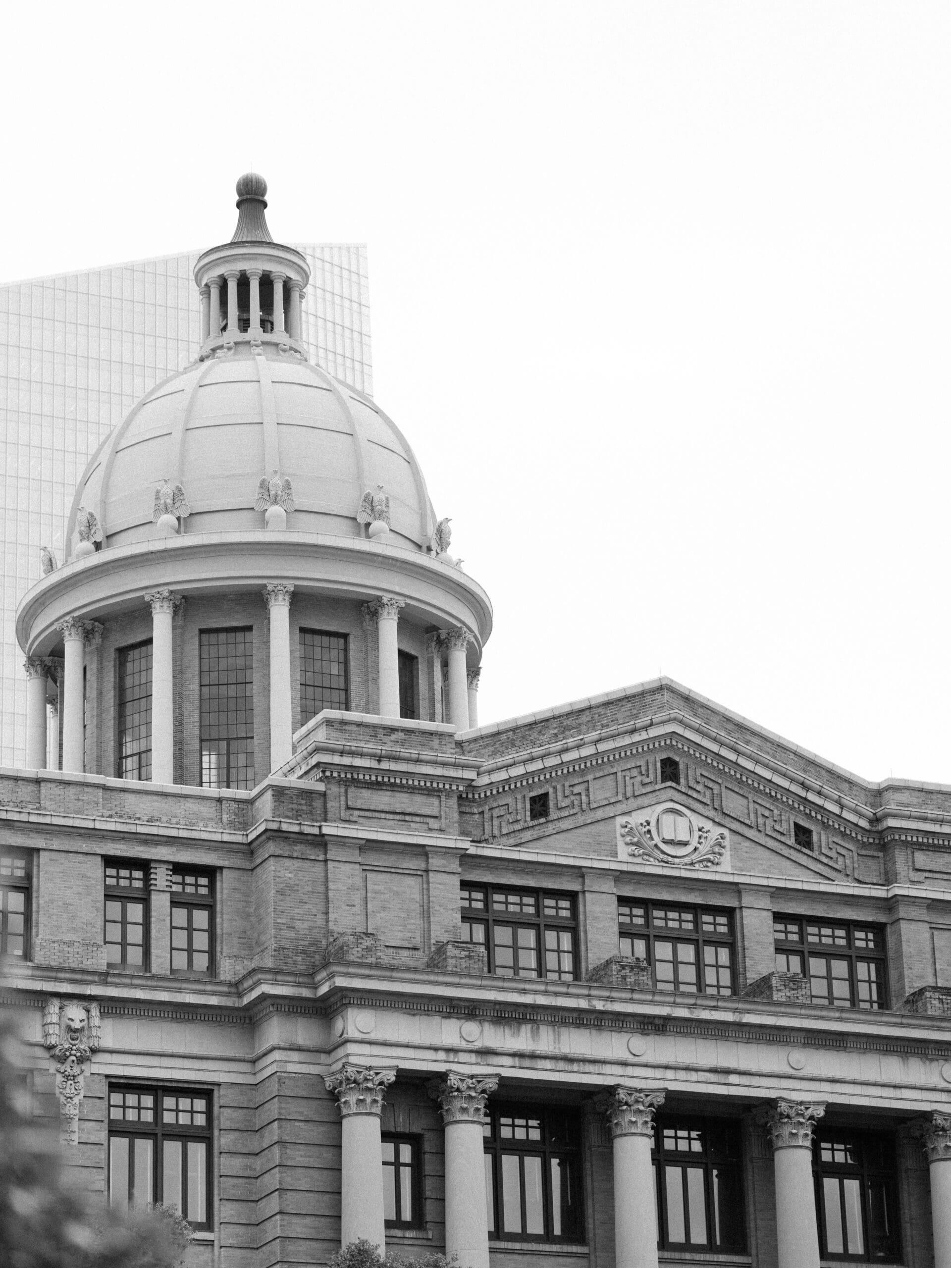 Black and white architectural shot of a domed courthouse building in downtown Houston
