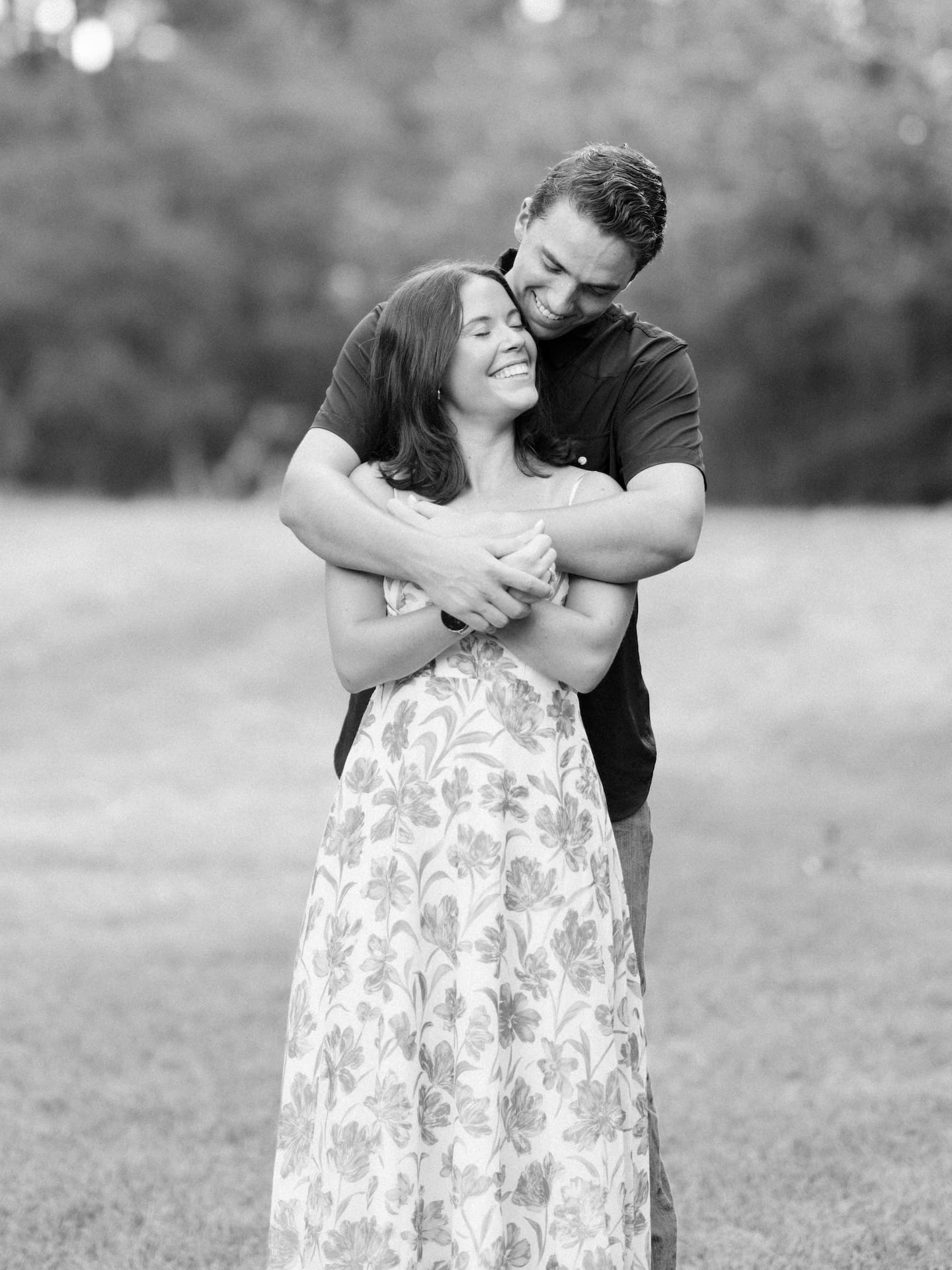 Surprise Engagement Proposal Ideas captured in black and white as a couple shares a warm embrace.